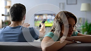 Couple arguing over watching tv, man and woman having conflict, relationship