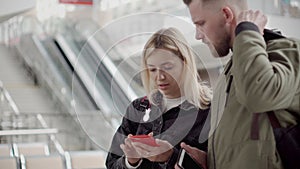 Couple arrived in airport.