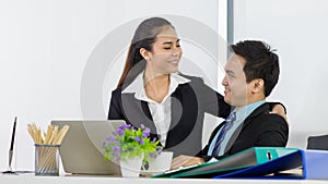 Couple asian office people look happiness. Asian woman and man employee couple teammate smiling and look feel very happy in office