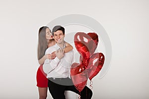 Couple with balloons in Valentine Day
