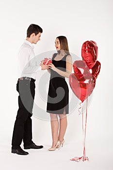 Couple with balloons in Valentine Day