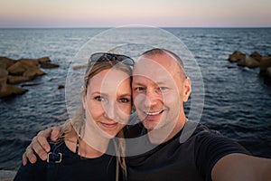 A couple at the Barcelona Beach at sunset