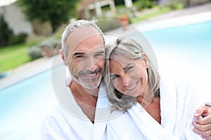 Couple in bathrobe relaxing in spa hotel