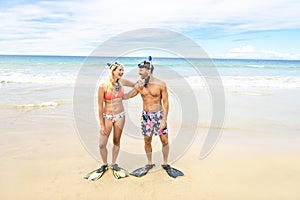 Couple on the beach is going to swim and snorkle on hawaii beach