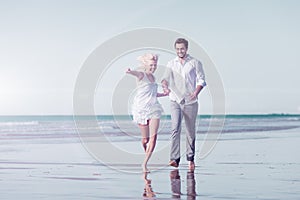 Couple on beach in honeymoon vacation photo