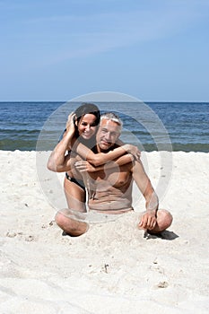 Couple on the beach hugging