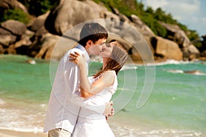 Couple on the beach kiss