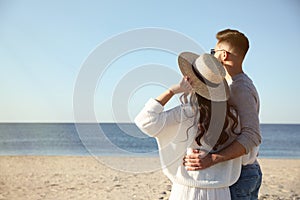 Couple on beach near sea. Honeymoon trip