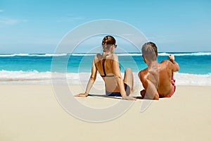 Couple On Beach In Summer. Romantic People On Sand At Resort