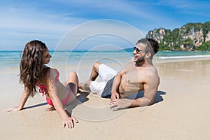 Couple On Beach Summer Vacation, Young People Sitting On Sand, Man Woman Sea Ocean