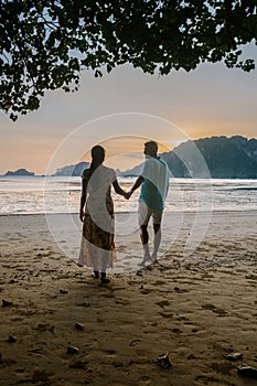 Couple on the beach during sunset at the tropical Krabi area Thailand, Ao Nam Mao beach Krabi Ao Nang area Thailand,men