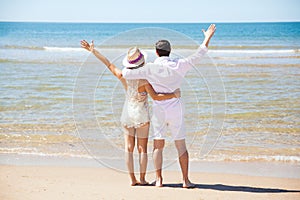 Couple at the beach for their honeymoon