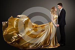 Couple, Beautiful Woman in Golden Silk Dress and Elegant Man, Fluttering Gown
