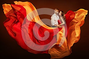 Couple Beauty Portrait, Man and Dreaming Woman in Waving Dress as Flame on Wind