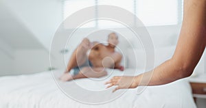 Couple, bed and hand with underwear on duvet for love, romance or intimacy in affection, morning or seduction at home