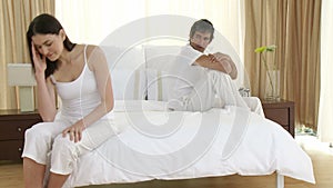 Couple in bed having an argument