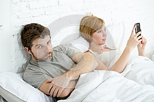 Couple in bed husband frustrated upset and unsatisfied while his internet couple in bed husband frustrated upset unsatisfied while