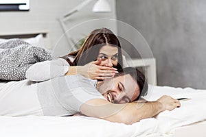 Couple in bed lying and havin fun