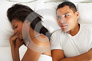 Couple In Bed With Relationship Difficulties