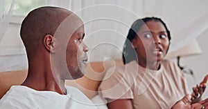 Couple, bedroom and dispute with anxiety, stress and drama at home or apartment. Frustrated, woman and man with argument