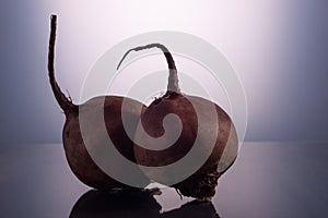 couple beets on white background, minimalistic still life