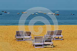 Couple benches on the beach