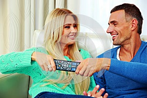 Couple bickering to change tv channel