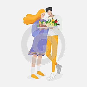 Couple with big plate of healthy organics foods - vegetables and fruits