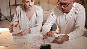 Couple bills family debt wife husband calculating
