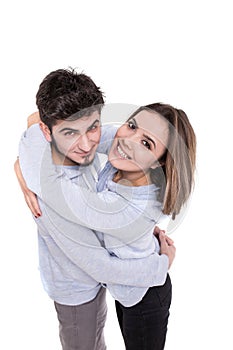 Couple in blue hugging isolated on white