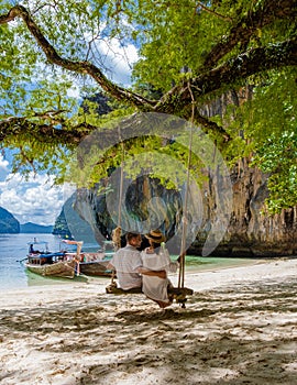 Couple on a boat trip to the Tropical lagoon of Koh Loa Lading Krabi Thailand part of Koh Hong