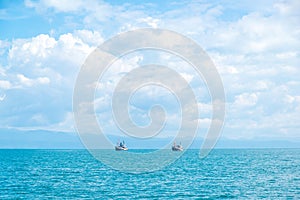 Couple boats in the blue sea