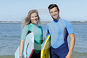 couple bodyboarders looking at camera