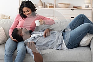 Couple Bonding. Happy African American Spouses Having Romantic Moments At Home
