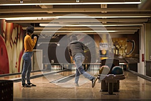 Couple in bowling alley.