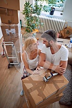 Couple with boxes - couple moving into a new home