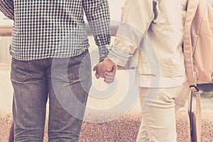 Couple boy and girl holding hands together