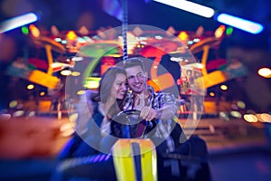 Couple in bumper car - shoot with lensbaby photo