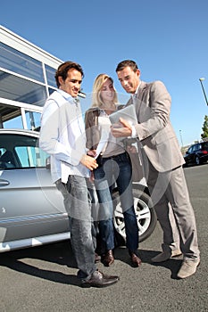 Couple buying new car