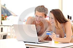 Couple buying online on holidays