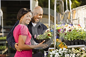 Couple buying plants.