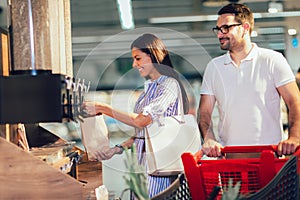 Couple bying products in zero waste shop photo