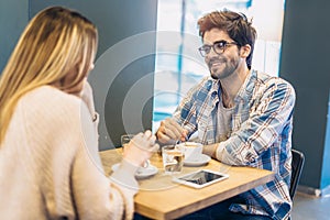 Couple in cafe enjoying the time spending with each other