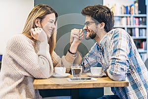 Couple in cafe enjoying the time spending with each other