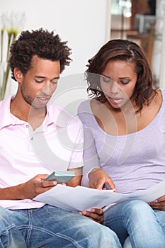 Couple calculating their budget