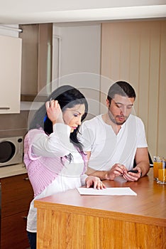 Couple calculating and writing photo