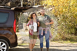 Couple of campers with sleeping bag and mat