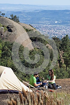 Couple Camping Above the City