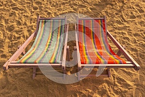 A couple canvas beds on the beach with sunset light atmospher photo