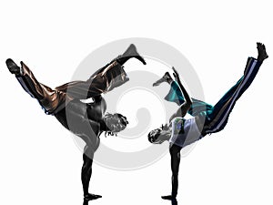 Couple capoeira dancers dancing silhouette